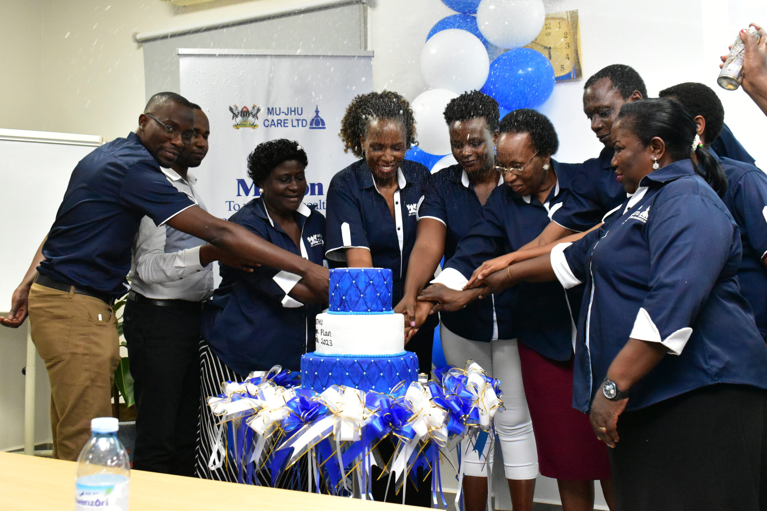 Change Agents cut cake during the internal strategic plan launch